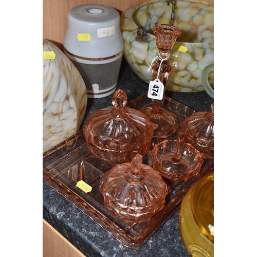 474 - A QUANTITY OF COLOURED GLASS, comprising a 1920's  amber pressed glass rose bowl, a six piece rose c... 