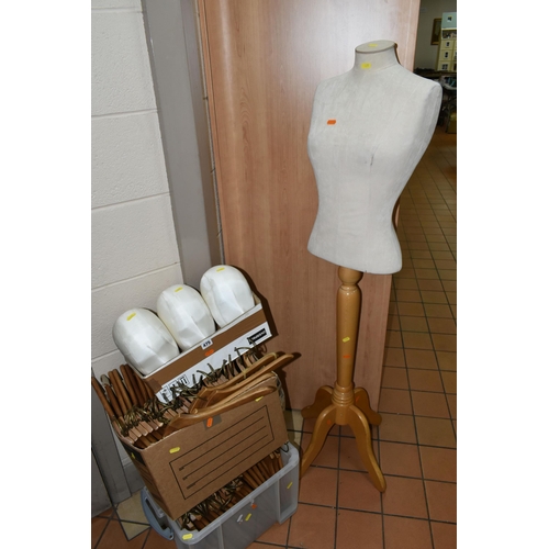 475 - TWO SHOP MANNEQUINS AND A QUANTITY OF WOODEN COAT HANGERS, comprising a seated child mannequin (miss... 