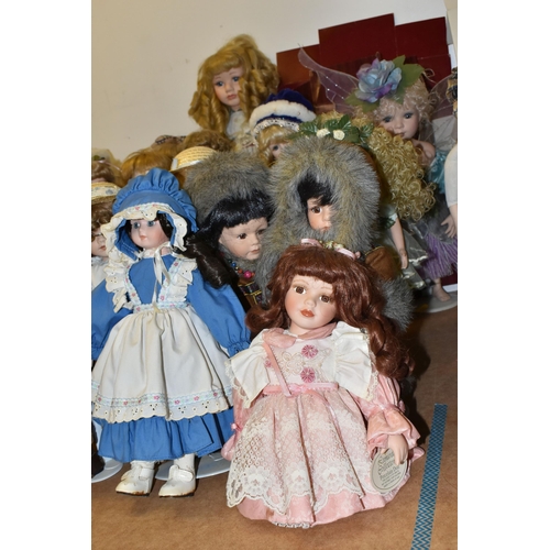 487 - A GROUP OF COLLECTORS DOLLS, seventeen male and female dolls, including pairs of Victorian style and... 