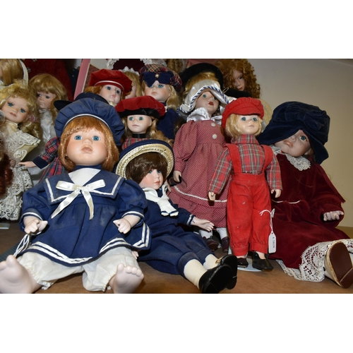 492 - A GROUP OF COLLECTORS DOLLS, fourteen male and female dolls, including pairs of dolls, a bride and d... 