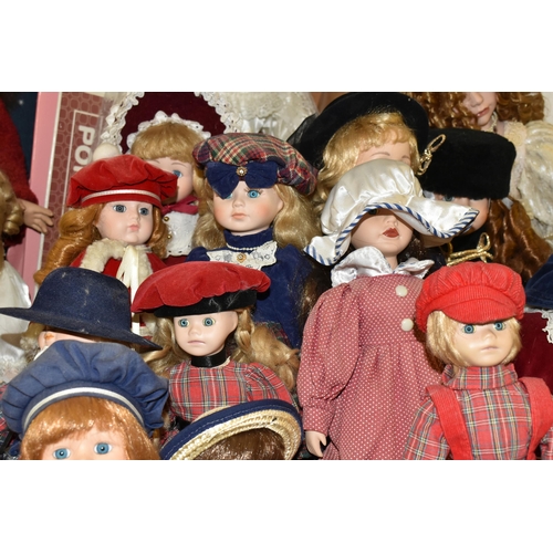 492 - A GROUP OF COLLECTORS DOLLS, fourteen male and female dolls, including pairs of dolls, a bride and d... 