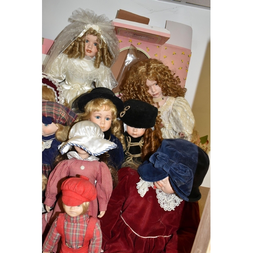 492 - A GROUP OF COLLECTORS DOLLS, fourteen male and female dolls, including pairs of dolls, a bride and d... 