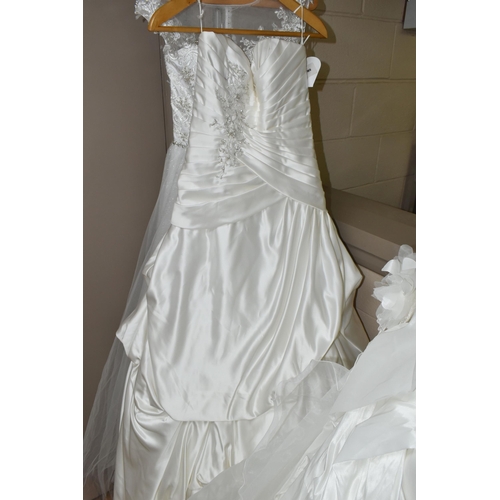 542 - TEN WEDDING DRESSES, retail stock clearance, a collection of styles including Princess line, Mermaid... 