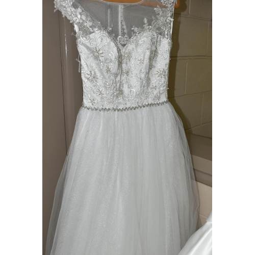 542 - TEN WEDDING DRESSES, retail stock clearance, a collection of styles including Princess line, Mermaid... 