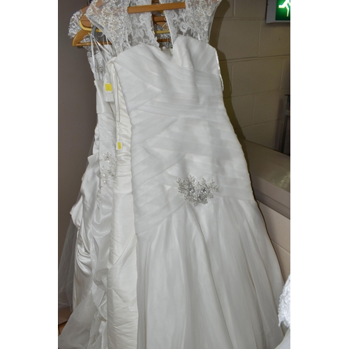 542 - TEN WEDDING DRESSES, retail stock clearance, a collection of styles including Princess line, Mermaid... 