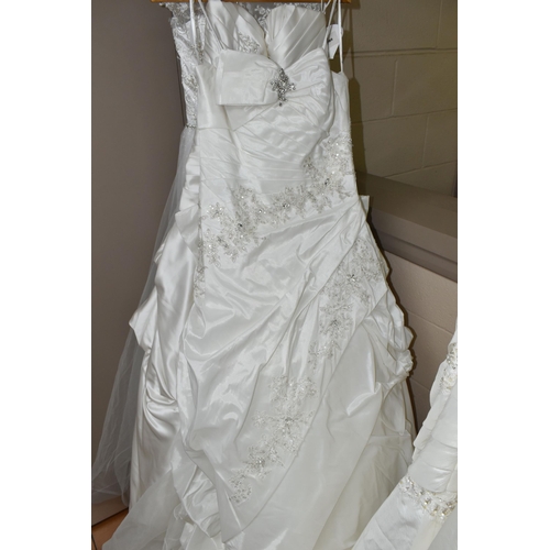 542 - TEN WEDDING DRESSES, retail stock clearance, a collection of styles including Princess line, Mermaid... 