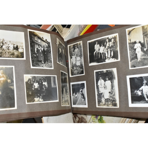 553 - TWO BOXES OF EPHEMERA to include a large collection of early-mid 20th century family photographs and... 