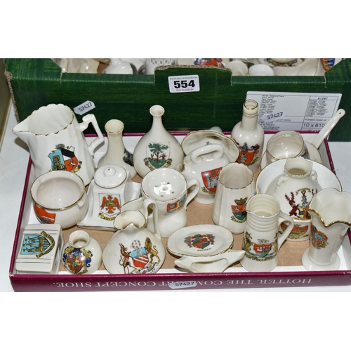 554 - A QUANTITY OF CRESTED WARE, to include an assortment of miniature pots, jars and vases, maker's name... 