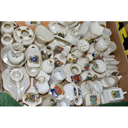 554 - A QUANTITY OF CRESTED WARE, to include an assortment of miniature pots, jars and vases, maker's name... 