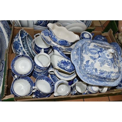 556 - FOUR BOXES OF EARLY 20TH CENTURY BLUE AND WHITE CERAMICS, comprising a large quantity of plates, mea... 