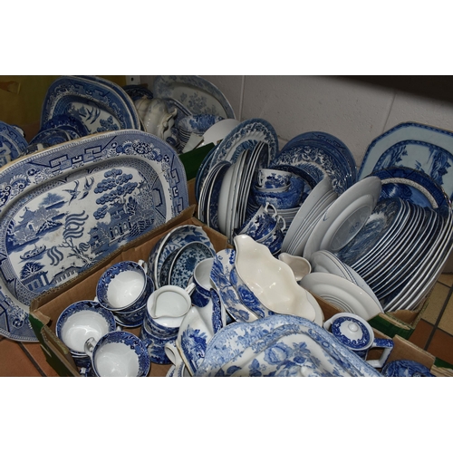 556 - FOUR BOXES OF EARLY 20TH CENTURY BLUE AND WHITE CERAMICS, comprising a large quantity of plates, mea... 