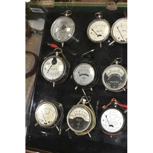 584 - A MODERN DISPLAY CASE CONTAINING VINTAGE POCKET VOLTMETERS makers include Brevete Sifam, Sutra Paris... 