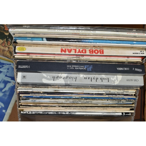 595 - A BOX CONTAINING APPROX FIFTY LPs, A SINGLE AND A TAPE BOXSET including 32 by Bob Dylan items of not... 