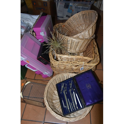 596 - TWO BOXES OF ASSORTED SUNDRIES, to include wicker baskets, table linen, vintage road maps, a Canon P... 