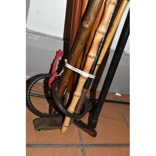 648 - SEVEN ANTIQUE AND VINTAGE RIDING CROPS AND WALKING STICKS ETC, to include a crop with silver collar ... 