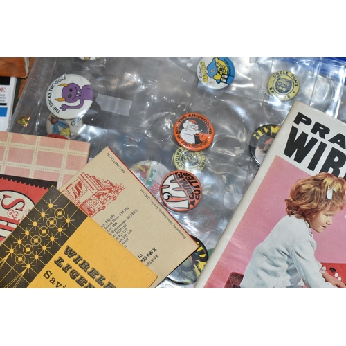 651 - TWO BOXES OF VINTAGE MAGAZINES, POSTCARDS AND EPHEMERA, to include a collection of 1970's/1980's pin... 