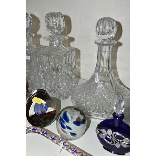 664 - A COLLECTION OF CUT GLASS DECANTERS AND STUDIO GLASS PAPERWEIGHTS, comprising a Nailsea glass walkin... 