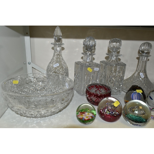 664 - A COLLECTION OF CUT GLASS DECANTERS AND STUDIO GLASS PAPERWEIGHTS, comprising a Nailsea glass walkin... 