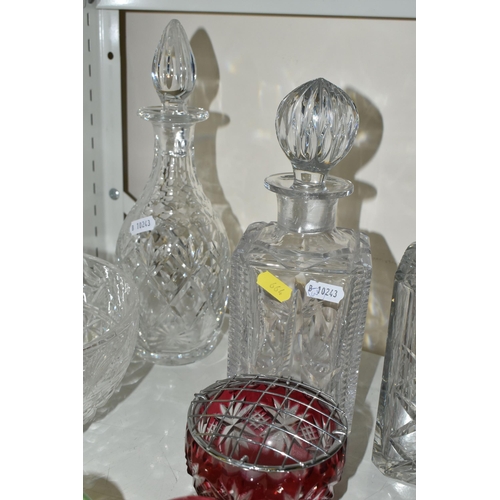 664 - A COLLECTION OF CUT GLASS DECANTERS AND STUDIO GLASS PAPERWEIGHTS, comprising a Nailsea glass walkin... 