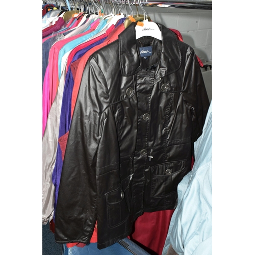 695 - A QUANTITY OF WOMEN'S CLOTHING, to include a black and white fur jacket, a Barbour 'Solway Zipper' w... 