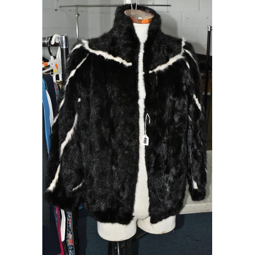 695 - A QUANTITY OF WOMEN'S CLOTHING, to include a black and white fur jacket, a Barbour 'Solway Zipper' w... 