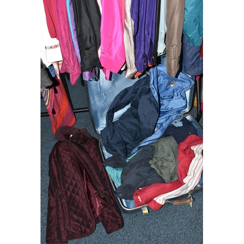 695 - A QUANTITY OF WOMEN'S CLOTHING, to include a black and white fur jacket, a Barbour 'Solway Zipper' w... 