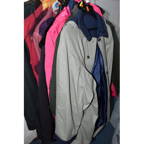 695 - A QUANTITY OF WOMEN'S CLOTHING, to include a black and white fur jacket, a Barbour 'Solway Zipper' w... 