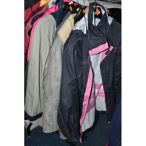 695 - A QUANTITY OF WOMEN'S CLOTHING, to include a black and white fur jacket, a Barbour 'Solway Zipper' w... 