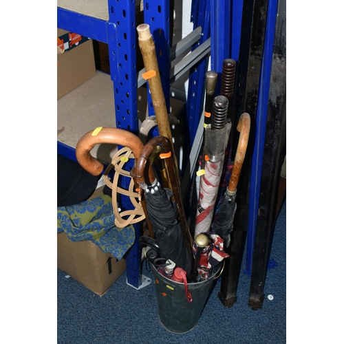 704 - TWO BOXES AND LOOSE WALKING STICKS, VINTAGE CLOTHES, ACCESSORIES AND LINENS, to include a tall galva... 