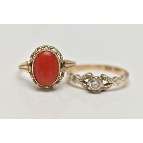 133 - TWO GEM SET RINGS, the first a yellow metal ring set with an oval coral cabochon, openwork gallery, ... 