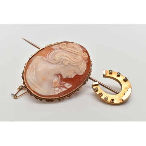 149 - A YELLOW METAL CAMEO BROOCH AND A STICK PIN, the carved shell cameo depicting a lady in profile, col... 