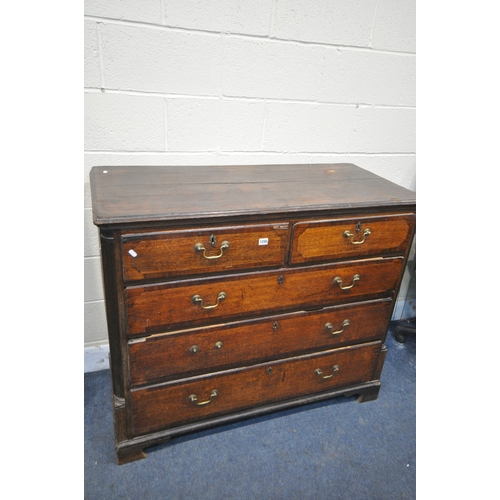 1200 - A GEORGIAN OAK AND CROSSBANDED CHEST OF TWO SHORT OVER THREE LONG GRADUATED DRAWERS, with brass swan... 