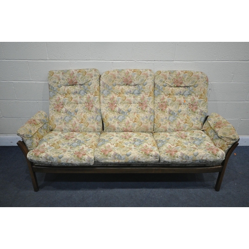 1288 - AN ERCOL THREE SEATER SETTEE, with a later seat support, length 192cm (condition:-dirty fabric)