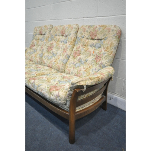 1288 - AN ERCOL THREE SEATER SETTEE, with a later seat support, length 192cm (condition:-dirty fabric)