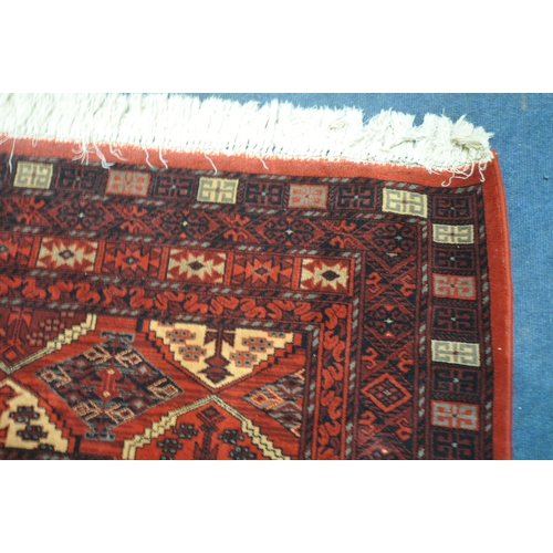 1289 - A LARGE SUPER KESHAN 100% WORSTED WOOL RED GROUND RUG, 366cm x 274cm (condition:-good condition)