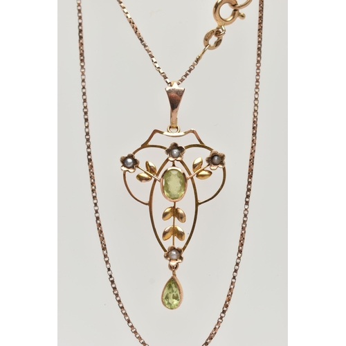 119 - A YELLOW METAL LAVALIER PENDANT AND CHAIN, openwork pendant set with a central oval cut peridot with... 