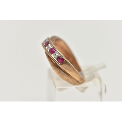 25 - A 9CT GOLD RUBY AND DIAMOND HALF ETERNITY RING, set with a row of alternating rubies and single cut ... 