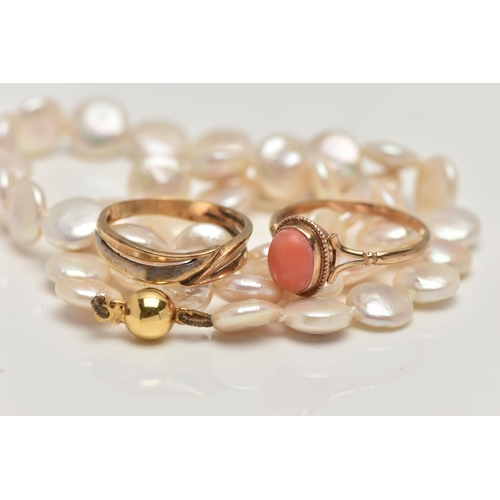 28 - TWO RINGS AND A CULTURED PEARL NECKLACE, the first  a coral cabochon ring, bifurcated shoulders lead... 