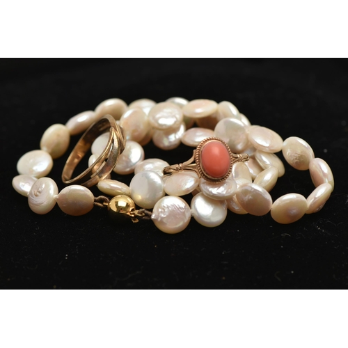 28 - TWO RINGS AND A CULTURED PEARL NECKLACE, the first  a coral cabochon ring, bifurcated shoulders lead... 