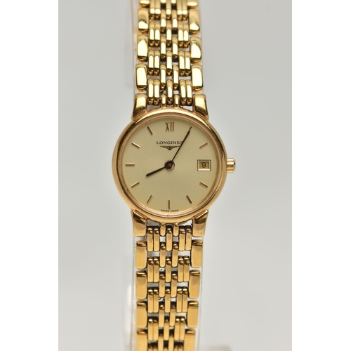 32 - A LADYS 'LONGINES' WRISTWATCH AND A TIMEX WATCH, quartz Longines, round gold dial signed 'Longines',... 