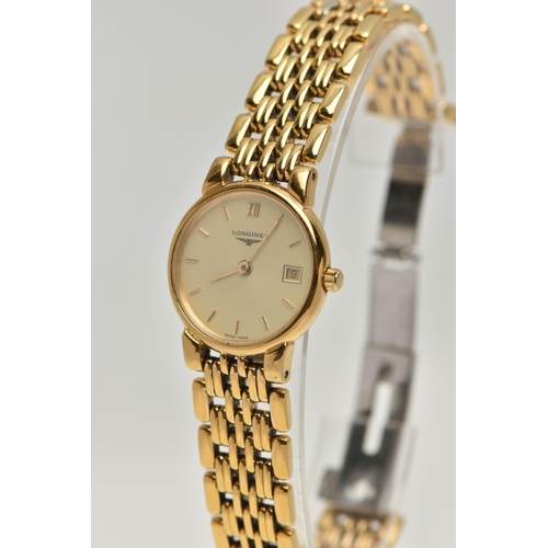 32 - A LADYS 'LONGINES' WRISTWATCH AND A TIMEX WATCH, quartz Longines, round gold dial signed 'Longines',... 