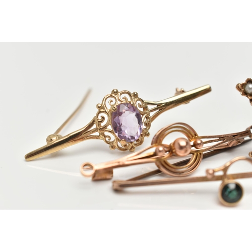 35 - FOUR BROOCHES, the first set with an oval cut amethyst with a split pearl surround, in an unmarked y... 