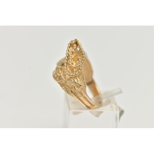 53 - A 9CT GOLD RING, in the form of a patterned saddle, hallmarked 9ct London, ring size M, approximate ... 