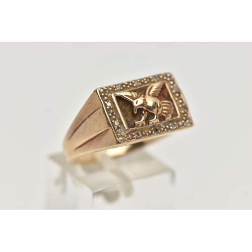 54 - A 9CT GOLD EAGLE SIGNET RING, of a rectangular form depicting a flying eagle, in a surround of singl... 