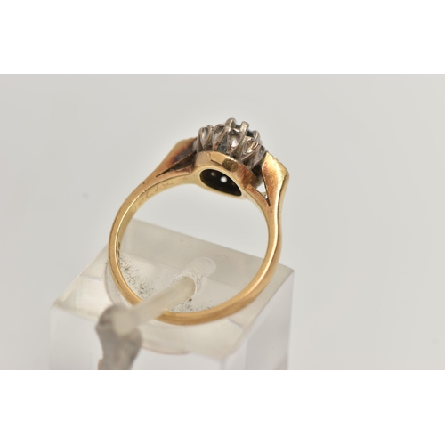 65 - AN 18CT GOLD, SAPPHIRE AND DIAMOND RING, centring on an oval cut blue sapphire in an eight claw sett... 