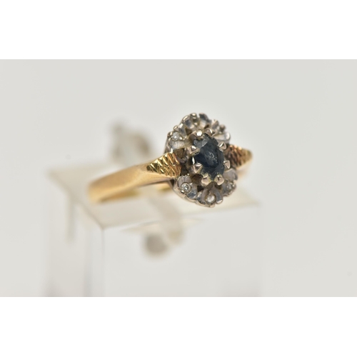 65 - AN 18CT GOLD, SAPPHIRE AND DIAMOND RING, centring on an oval cut blue sapphire in an eight claw sett... 