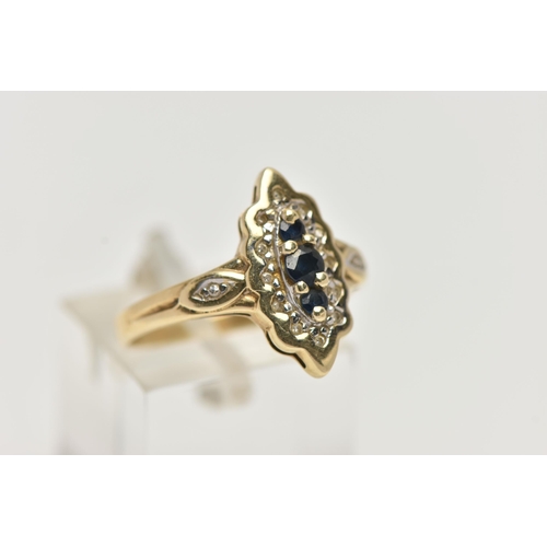 72 - A YELLOW METAL SAPPHIRE AND DIAMOND RING, lozenge shape ring set with a row of three blue sapphires,... 