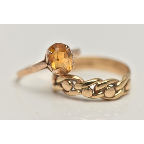 91 - A 9CT GOLD CITRINE RING AND A YELLOW METAL RING, the first a yellow gold ring set with an oval cut c... 