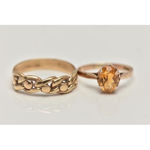 91 - A 9CT GOLD CITRINE RING AND A YELLOW METAL RING, the first a yellow gold ring set with an oval cut c... 