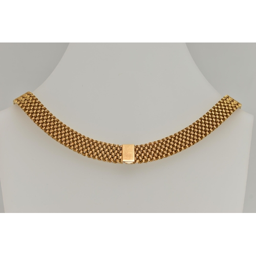 1 - AN 18CT GOLD ARTICULATED NECKLACE, flat woven articulated cross over necklace, fitted with an integr... 